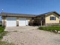 Building Photo - Spacious, four-bedroom, two-bathroom, coun...