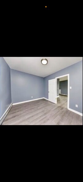 main floor bedroom to hallway and dining - 415 Weeden St