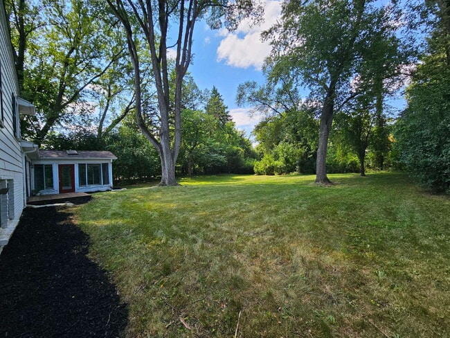 Building Photo - Private 4 Bedroom Home on 0.75 Acres with Great Room Fireplace, Wet Bar & 3-Season Room, 2 Car At...