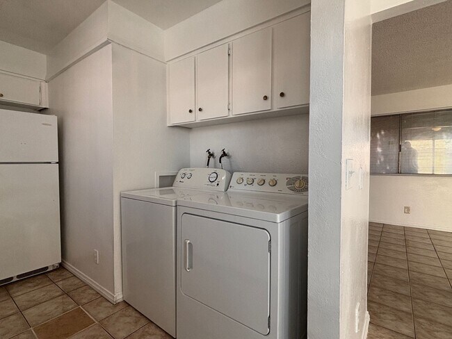 Building Photo - Desirable End-Unit Townhome with 2-Car Garage & Private Courtyard