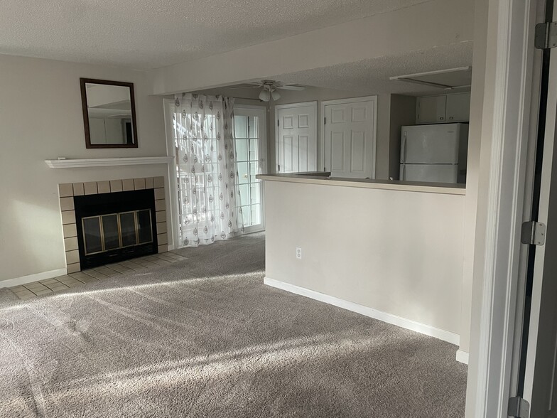 Living room connects to kitchen and deck - 868 S Reed Ct