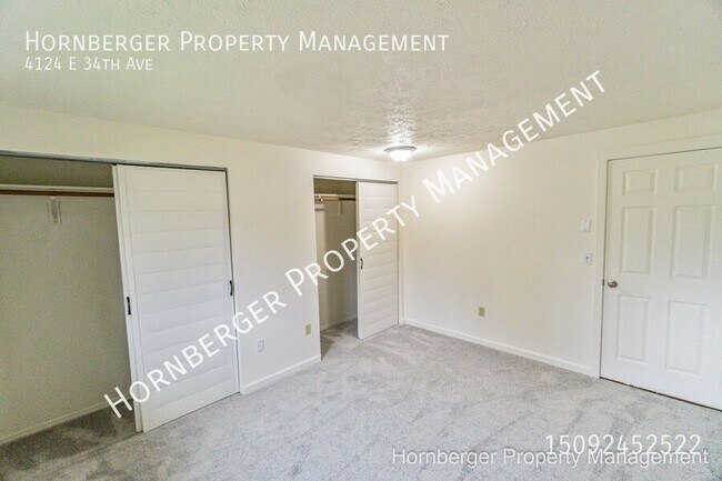 Building Photo - 4124 E 34th Ave