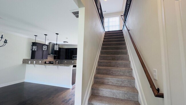 Building Photo - 4 bedroom 2.5 bathroom townhome located in Beaumont Park Townhome