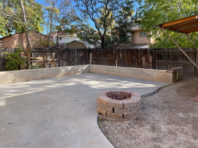 Backyard with fire pit - 5462 Gold Rush Dr NW