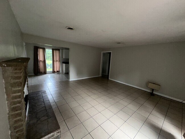 Building Photo - ONE LEVEL BRICK RANCHER WITH EXTRA LARGE LOT
