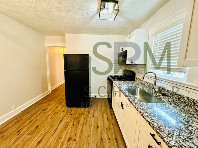 Building Photo - Remodeled 1 bedroom duplex with off street parking near Iroquois Park!