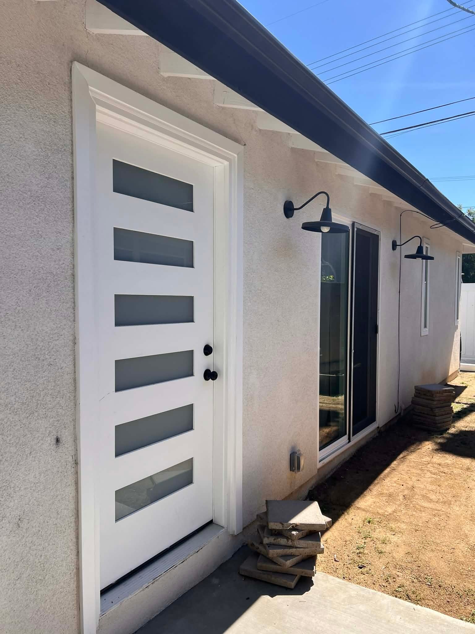 Front door with glass sliding doors from the living room - 16066 Bahama St