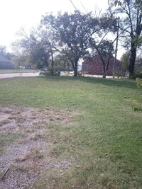 Building Photo - Cozy 2-Bedroom Home with Large Yard & Stor...