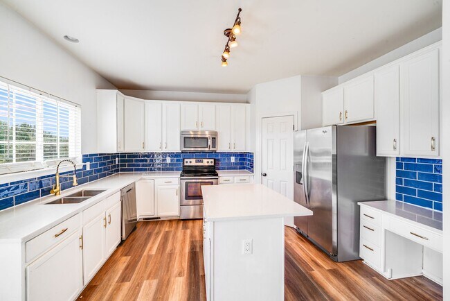 Building Photo - Enjoy Riverfront Living! Spacious 4-Bedroo...