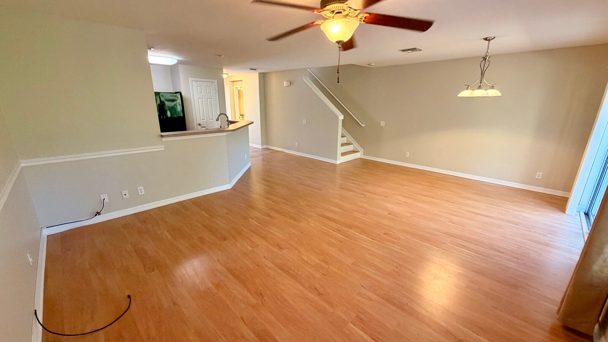 Living room looking into dining room - 15141 Piping Plover Ct