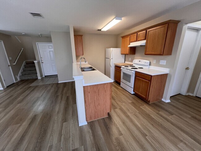 Building Photo - Generous Outdoor Space & Lawn Care Included!