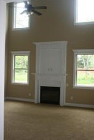 Formal living room with vaulted ceilings. - 319 Haywood Dr