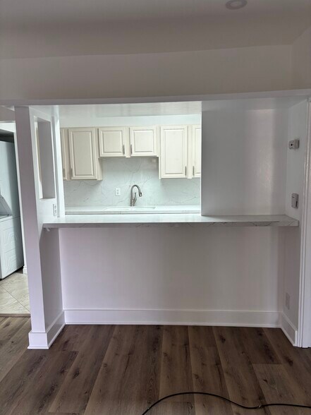 View into the kitchenbathroom - 713 Amoroso Pl
