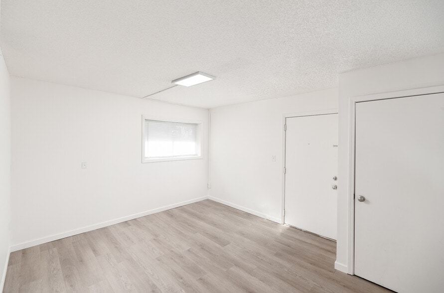 Living Area with Entry Closet - Stonewood Apartments