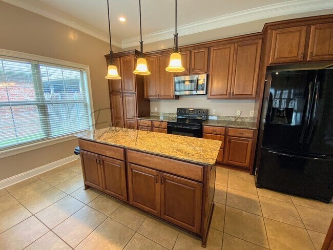 Building Photo - Family Home in Lafitte Landing – Fenced Ya...