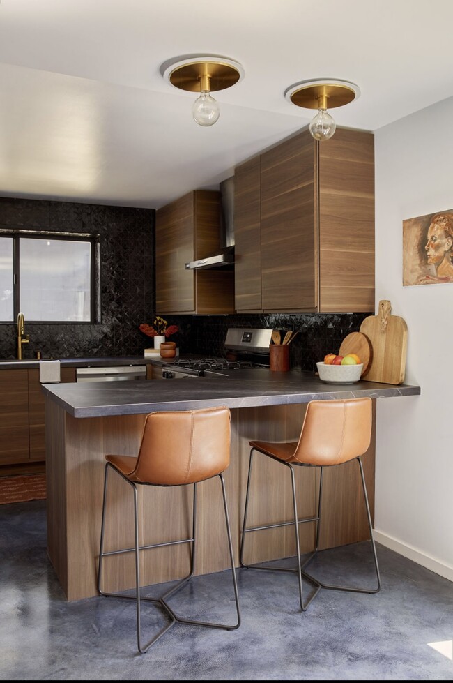 kitchen with bar seating - 6110 Hillandale Dr