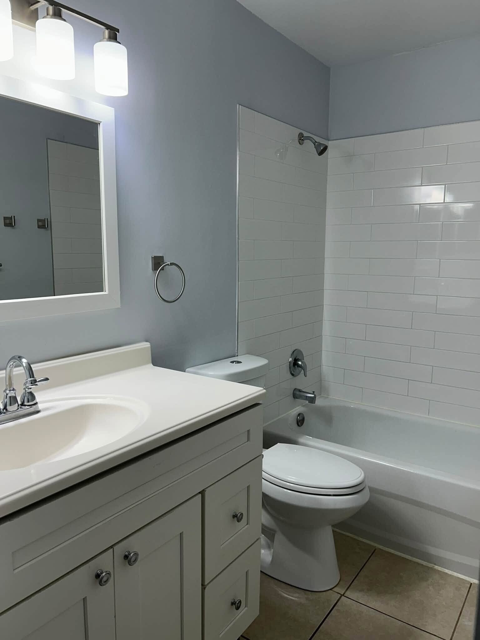 Main bathroom with upgraded shower and fixtures - 7669 SE James St