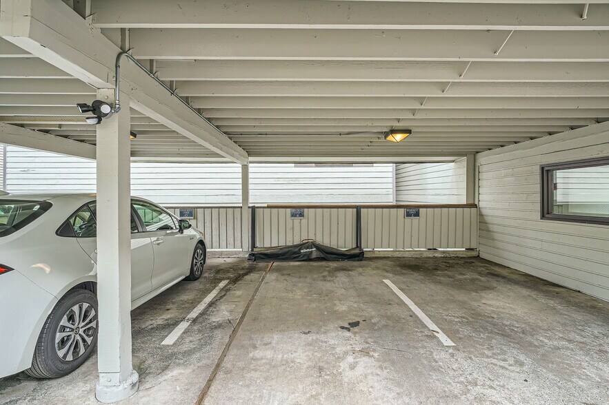Reserved Parking Stall with firewood rack - 2940 76th Ave SE
