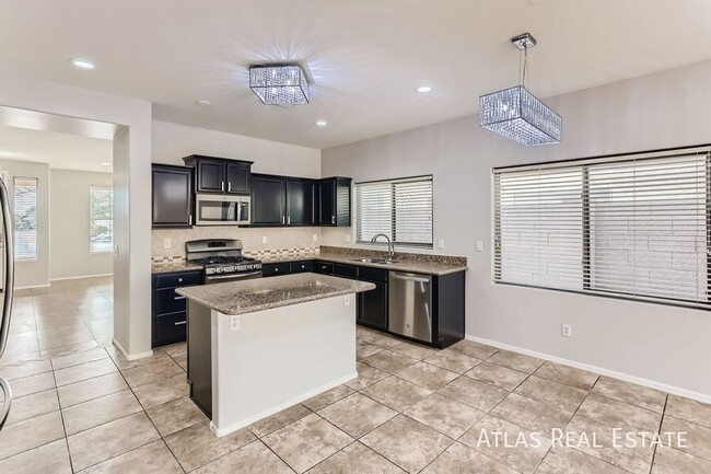 Building Photo - Spacious 4-Bedroom Home in Surprise, AZ! C...