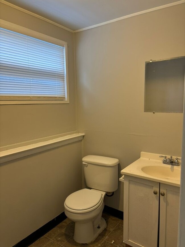 Building Photo - 3 BR 1.5 BA split-level with attached 1 ca...