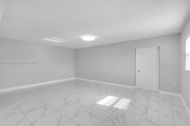 Building Photo - 5061 W 12th Ln