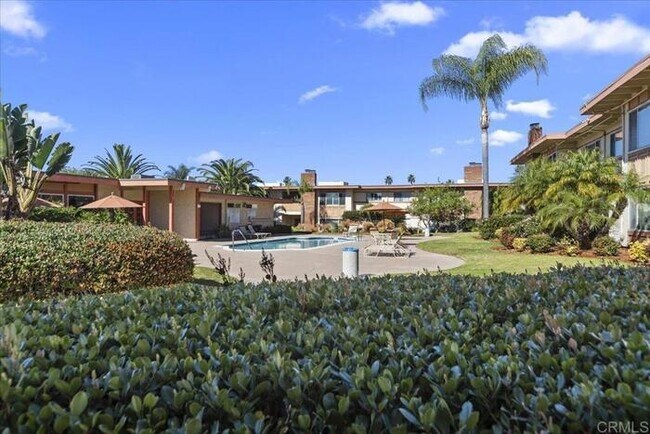 Building Photo - Poolside Living at Its Finest – Turnkey 3BR Condo with Direct Patio Access to the Pool