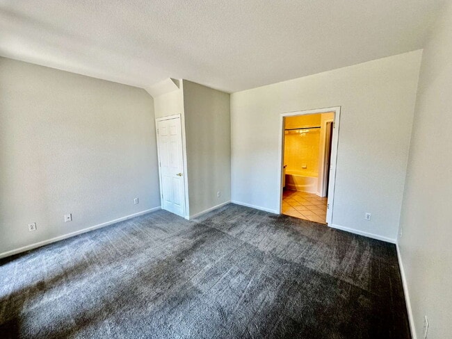Building Photo - "Spacious 2-Bed, 2-Bath Condo with Pool Ac...