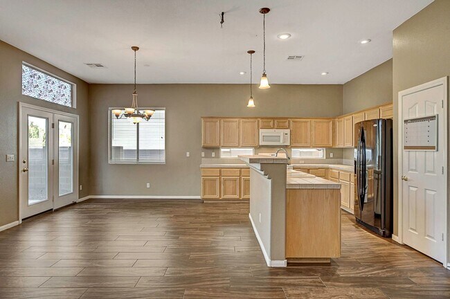 Building Photo - Gorgeous NW Single Story! 3 Car Garage! Serene Backyard.