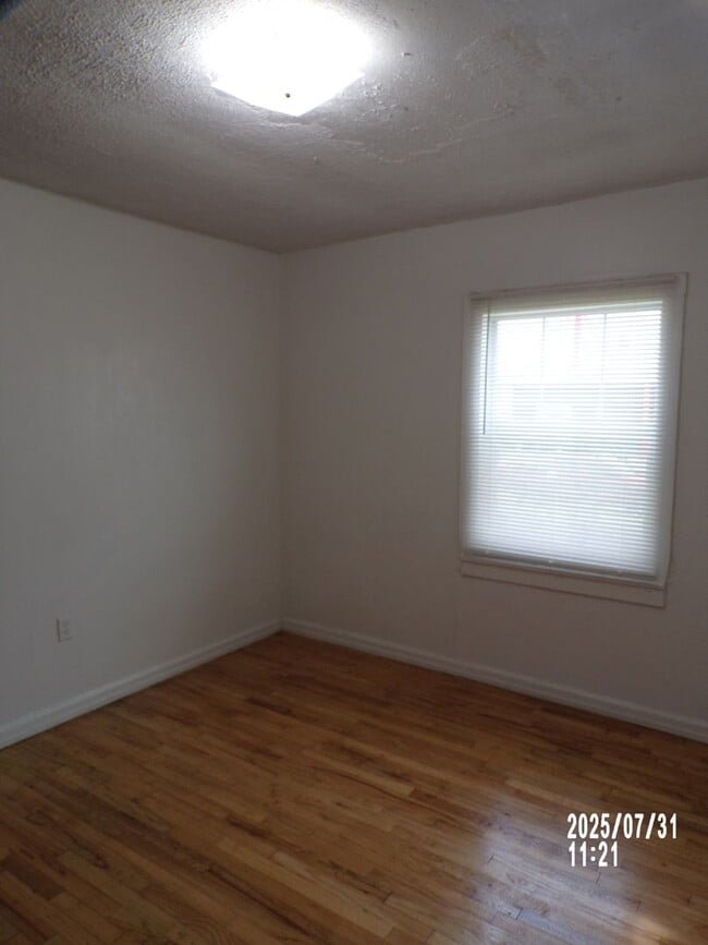 Building Photo - NEW listing-refinished hardwood floors, new laminate and paint throughout