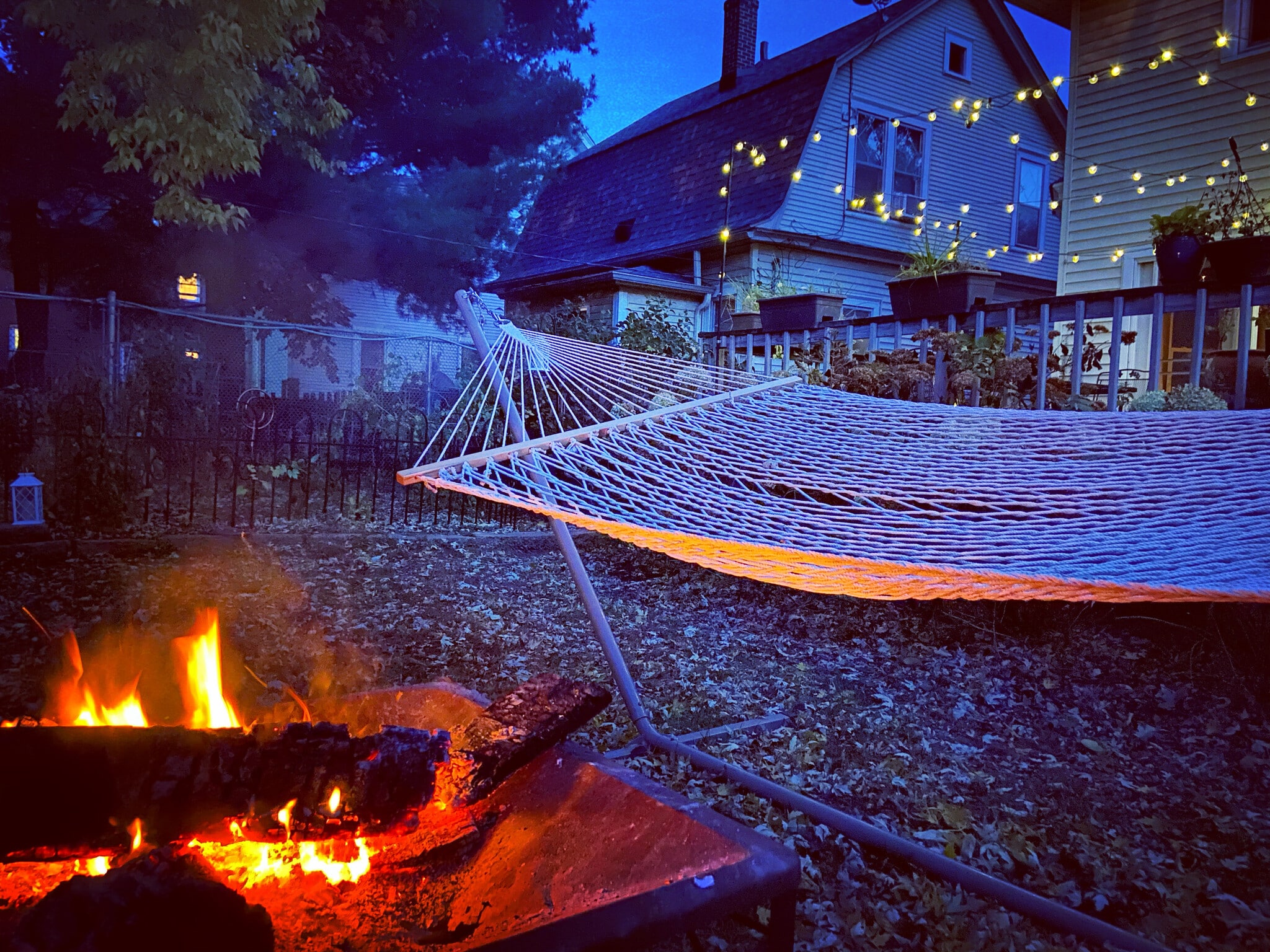 A backyard perfect for enjoying a campfire and relaxing in the hammock. - 819 Edmund Ave