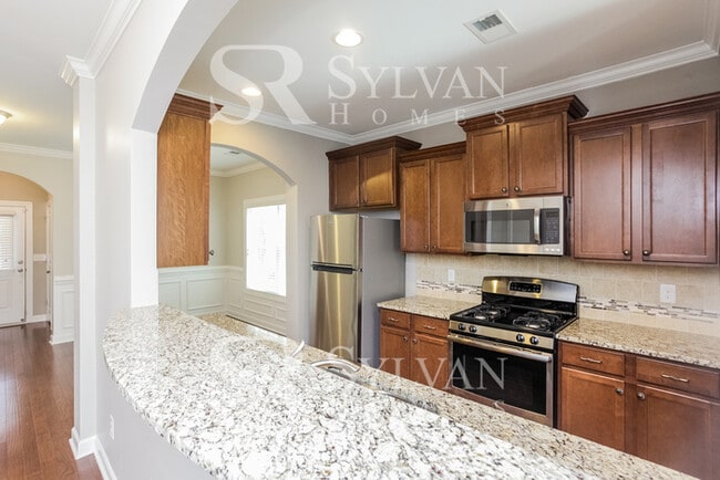 Building Photo - The living is easy in this lovely 5 bedroom, 2.5 bathroom home