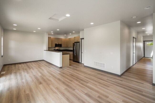 Building Photo - Pet Friendly! Gorgeous 3 Bedroom condo with double stall attached garages with AC.