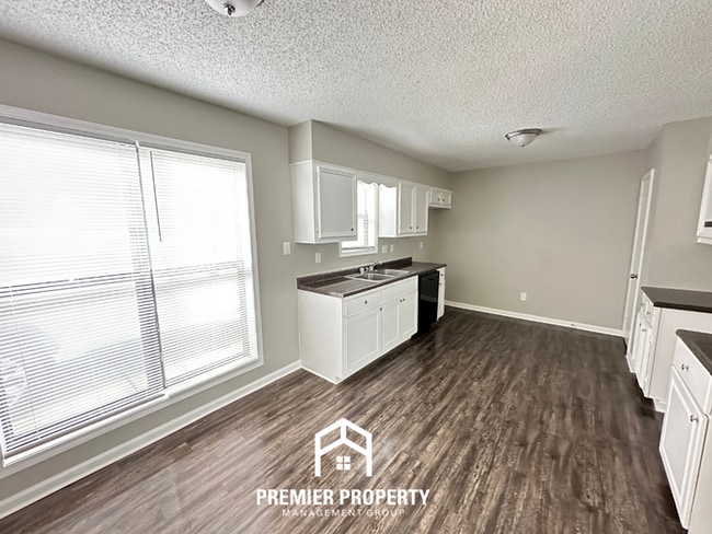 Building Photo - Quiet 3BR/2BA Cove Near Southwind | Soaring Ceilings & Floor-to-Ceiling Stone Fireplace