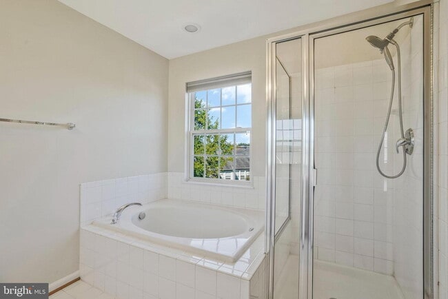 Building Photo - This beautifully maintained brick-front, three-level townhome is located in a highly sought-after...