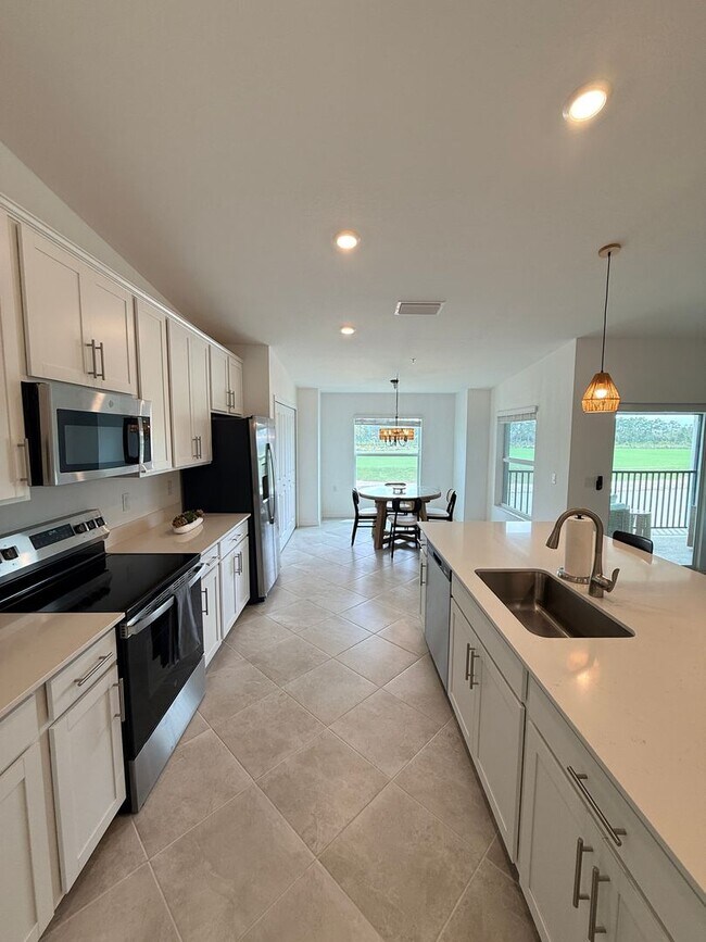 Building Photo - Beautifully Furnished Second-Floor Coach Home in the New Webb’s Reserve Golf & Country Club – Gol...