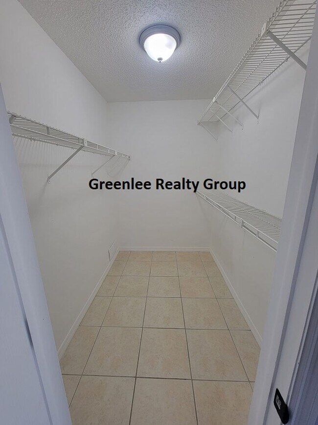 Building Photo - Relax by the water in this spacious 2-bedroom home with a 2-car garage, nestled in the highly des...