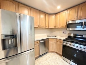 Newly renovated kitchen w/ laundry hook up - 99-24 67th Ave