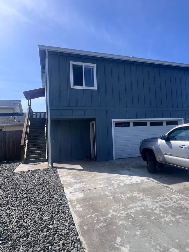 Building Photo - 2 Bedroom 1 bath house with extra large double car garage and extra storage space!