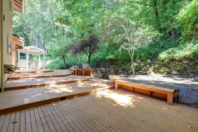 Building Photo - 4+ Bedroom with Great Entertaining Wrap Around Decks with VIEW of PUGET SOUND!!