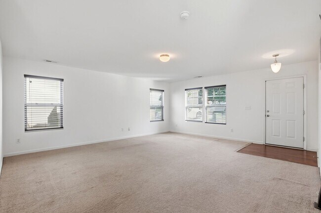 Building Photo - Spacious 4BR Home with New Carpet & Fenced Backyard