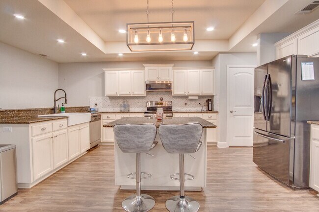 Building Photo - Milton 4BR Pool Home with Office, Vaulted Ceilings, Screened Saltwater Pool & 2-Car Garage