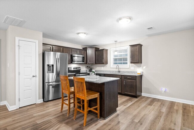 Building Photo - Stocked Pond, Walking Trails and More!!