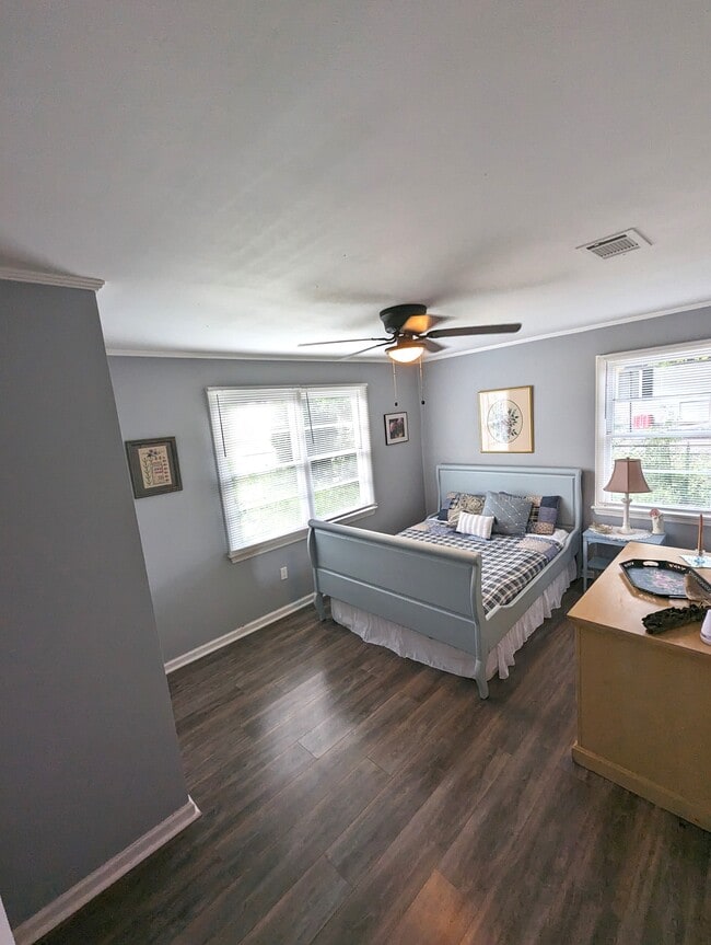 Bedroom 2 is warm and cozy. Queen bed, original art and a closet. - 4107 Crane St