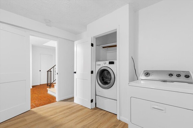 Spacious laundry room with a washer and dryer. Large enough for a folding table or storage. - 45 High St