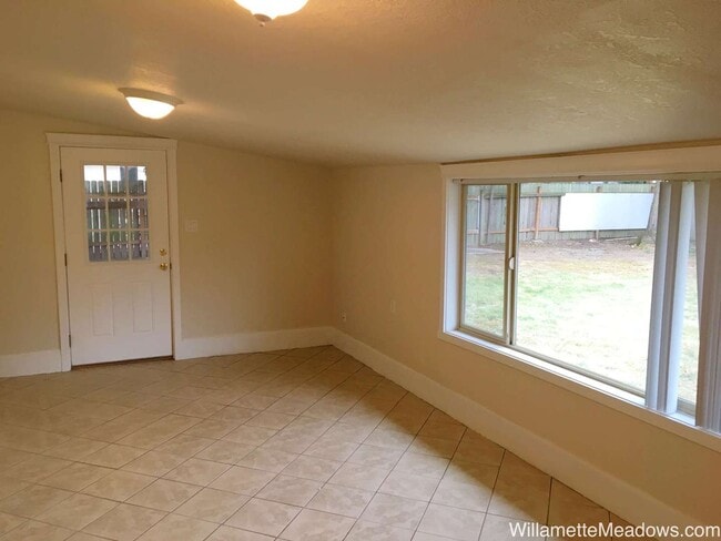 Building Photo - Spacious 4-Bedroom Home with Large Fenced Yard & Covered Patio