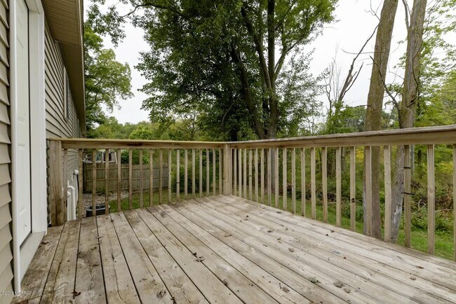 Building Photo - Spacious 3BR Duplex with Finished Basement & 2-Car Garage in Otsego