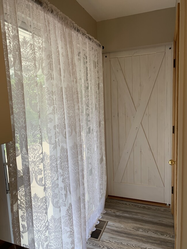 Kitchen hallway with barn door - 5136 Old Lemay Ferry Rd