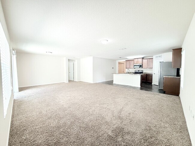 Building Photo - Spacious 4BR Home with Large Fenced Yard & Community Pool