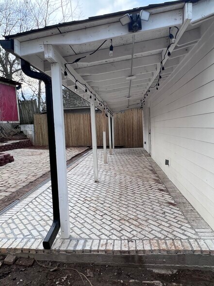 Patio Daytime View From Driveway - 620 Simpson St