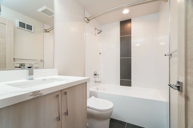 Building Photo - Stylish 3 Bedroom with Rooftop Decks and Dedicated Parking